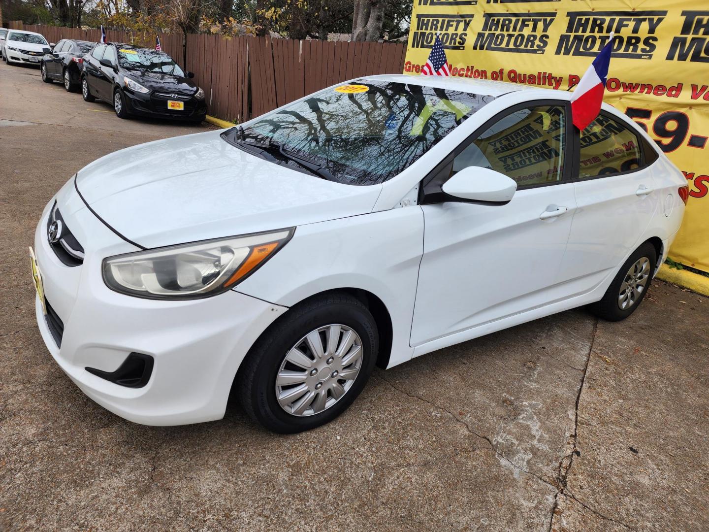 2017 White /Gray Hyundai Accent SE 4-Door 6M (KMHCT4AE5HU) with an 1.6L L4 DOHC 16V engine, 6M transmission, located at 16710 Clay Rd., Houston, TX, 77084, (281) 859-7900, 29.834864, -95.656166 - Low Down. Low Payments. - Photo#1