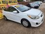 2017 White /Gray Hyundai Accent SE 4-Door 6M (KMHCT4AE5HU) with an 1.6L L4 DOHC 16V engine, 6M transmission, located at 16710 Clay Rd., Houston, TX, 77084, (281) 859-7900, 29.834864, -95.656166 - Low Down. Low Payments. - Photo#2