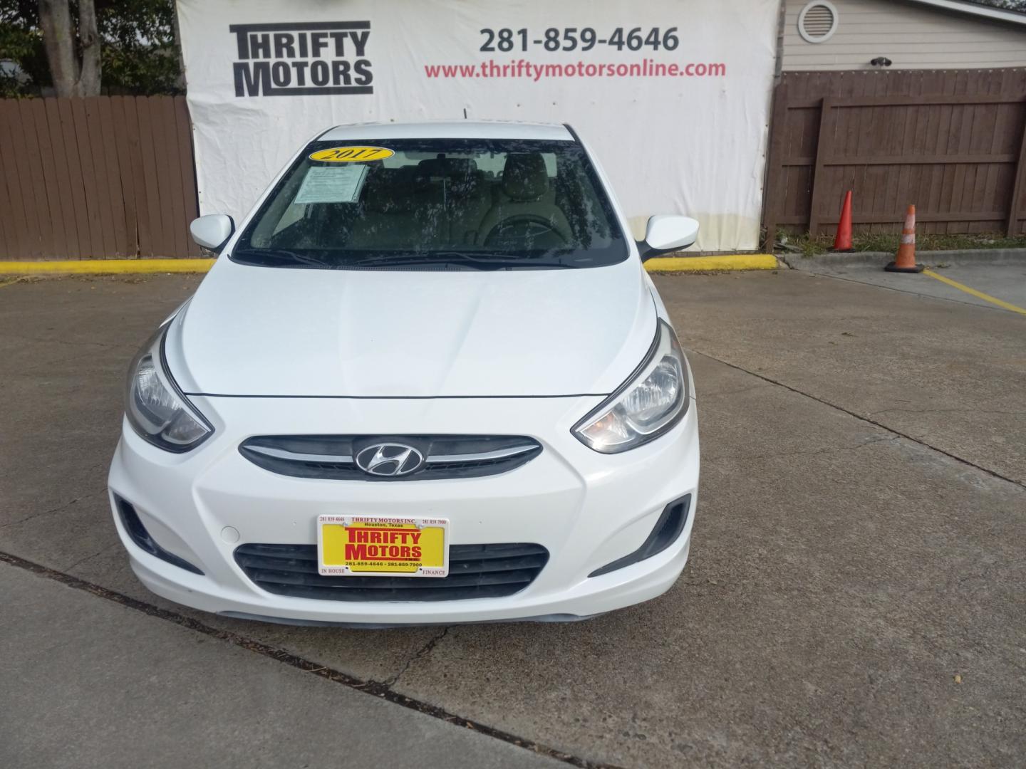 2017 White Hyundai Accent SE 4-Door 6M (KMHCT4AE5HU) with an 1.6L L4 DOHC 16V engine, 6M transmission, located at 16710 Clay Rd., Houston, TX, 77084, (281) 859-7900, 29.834864, -95.656166 - Low Down. Low Payments. - Photo#1