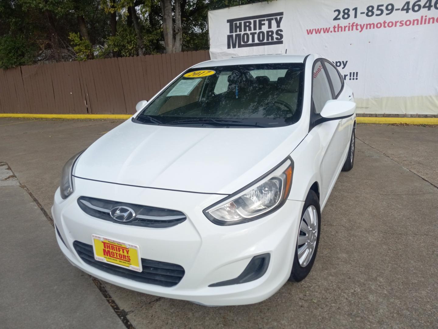 2017 White Hyundai Accent SE 4-Door 6M (KMHCT4AE5HU) with an 1.6L L4 DOHC 16V engine, 6M transmission, located at 16710 Clay Rd., Houston, TX, 77084, (281) 859-7900, 29.834864, -95.656166 - Low Down. Low Payments. - Photo#2