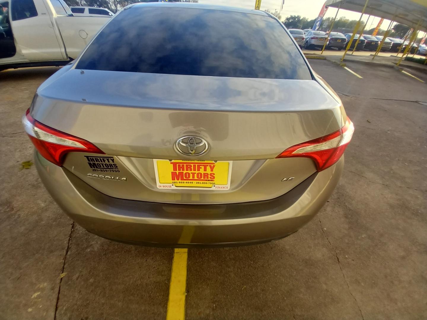 2016 BLACK Toyota Corolla L 4-Speed AT (5YFBURHE2GP) with an 1.8L L4 DOHC 16V engine, 4A transmission, located at 16710 Clay Rd., Houston, TX, 77084, (281) 859-7900, 29.834864, -95.656166 - Low Down. Low Payments. - Photo#5