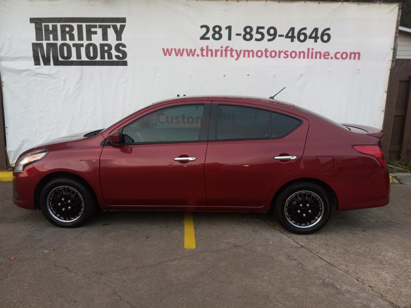 2019 Red Nissan Versa 1.6 SV Sedan (3N1CN7AP5KL) with an 1.6L L4 DOHC 16V engine, CVT transmission, located at 16710 Clay Rd., Houston, TX, 77084, (281) 859-7900, 29.834864, -95.656166 - Low Down. Low Payments. - Photo#0