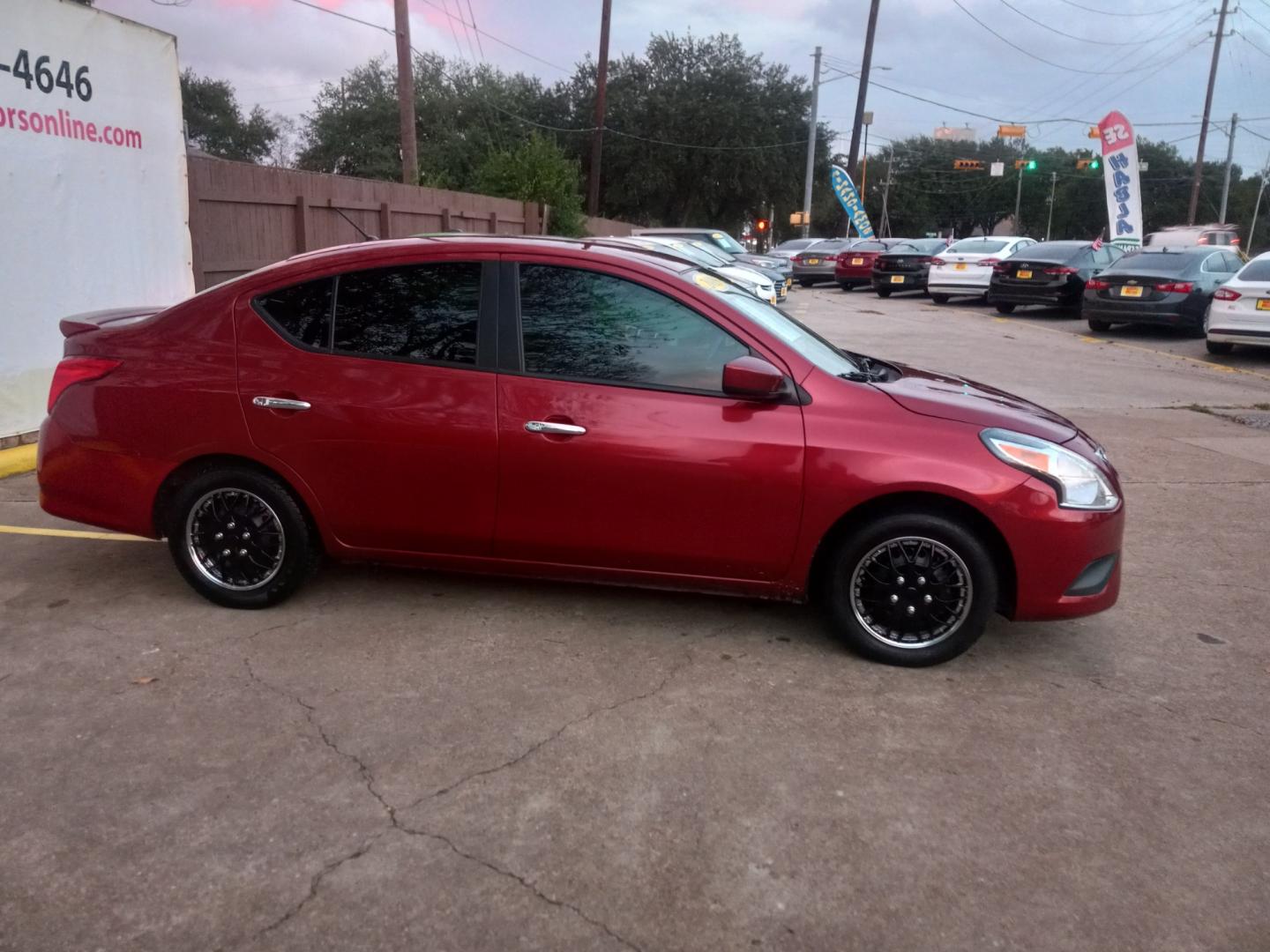 2019 Red Nissan Versa 1.6 SV Sedan (3N1CN7AP5KL) with an 1.6L L4 DOHC 16V engine, CVT transmission, located at 16710 Clay Rd., Houston, TX, 77084, (281) 859-7900, 29.834864, -95.656166 - Low Down. Low Payments. - Photo#3