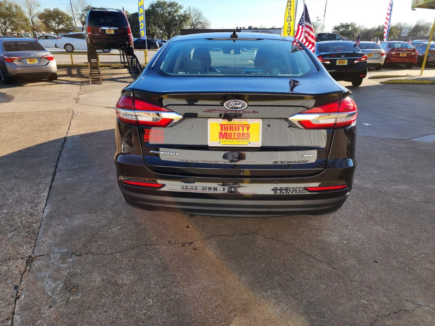 2019 Black Ford Fusion SE (3FA6P0H77KR) with an 2.5L L4 DOHC 16V engine, 6A transmission, located at 16710 Clay Rd., Houston, TX, 77084, (281) 859-7900, 29.834864, -95.656166 - Low Down. Low Payments. - Photo#5