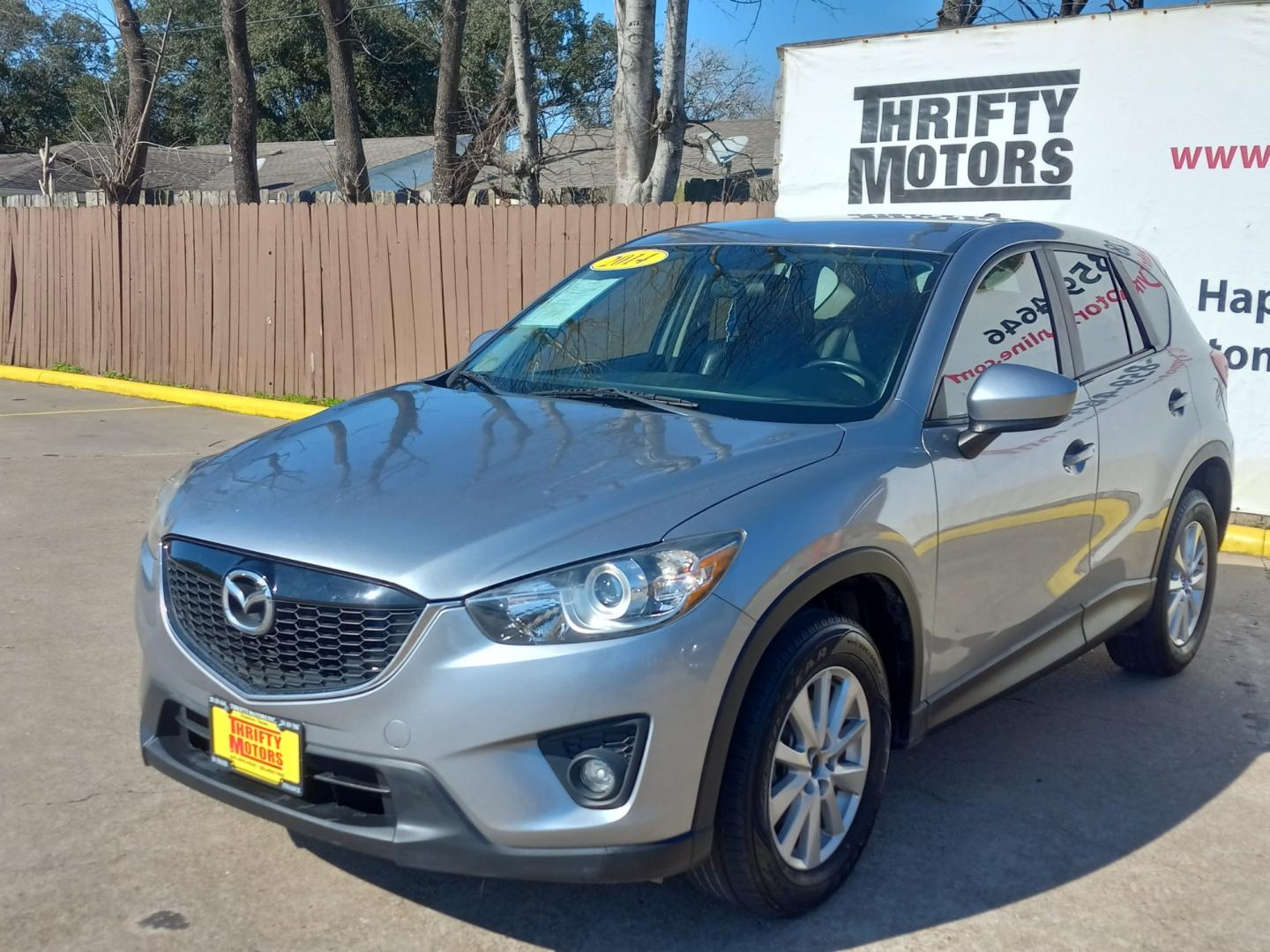 2014 Gray Mazda CX-5 Touring (JM3KE2CY9E0) with an 2.5L L4 DOHC 16V engine, 6-Speed Automatic transmission, located at 16710 Clay Rd., Houston, TX, 77084, (281) 859-7900, 29.834864, -95.656166 - Low Down. Low Payments. - Photo#2