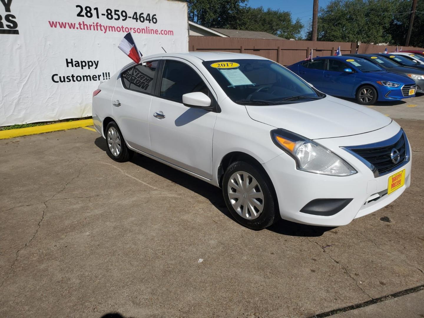 2017 White Nissan Versa 1.6 S 4A (3N1CN7APXHK) with an 1.6L L4 DOHC 16V engine, 4A transmission, located at 16710 Clay Rd., Houston, TX, 77084, (281) 859-7900, 29.834864, -95.656166 - Low Down. Low Payments. - Photo#2