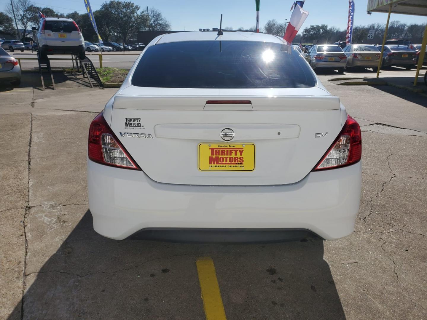 2017 White Nissan Versa 1.6 S 4A (3N1CN7APXHK) with an 1.6L L4 DOHC 16V engine, 4A transmission, located at 16710 Clay Rd., Houston, TX, 77084, (281) 859-7900, 29.834864, -95.656166 - Low Down. Low Payments. - Photo#4