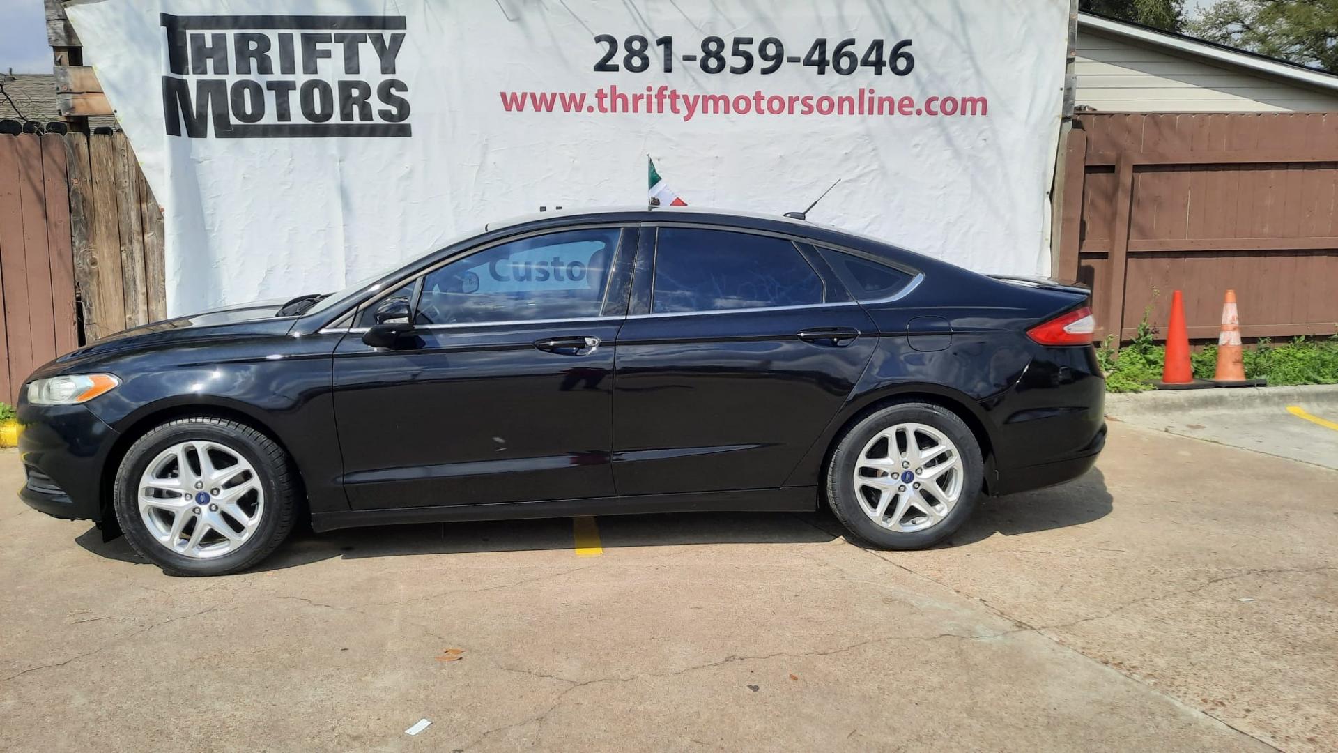 2013 Black Ford Fusion SE (3FA6P0HR7DR) with an 1.6L L4 DOHC 16V engine, located at 16710 Clay Rd., Houston, TX, 77084, (281) 859-7900, 29.834864, -95.656166 - LOW DOWN. LOW PAYMENTS. - Photo#0