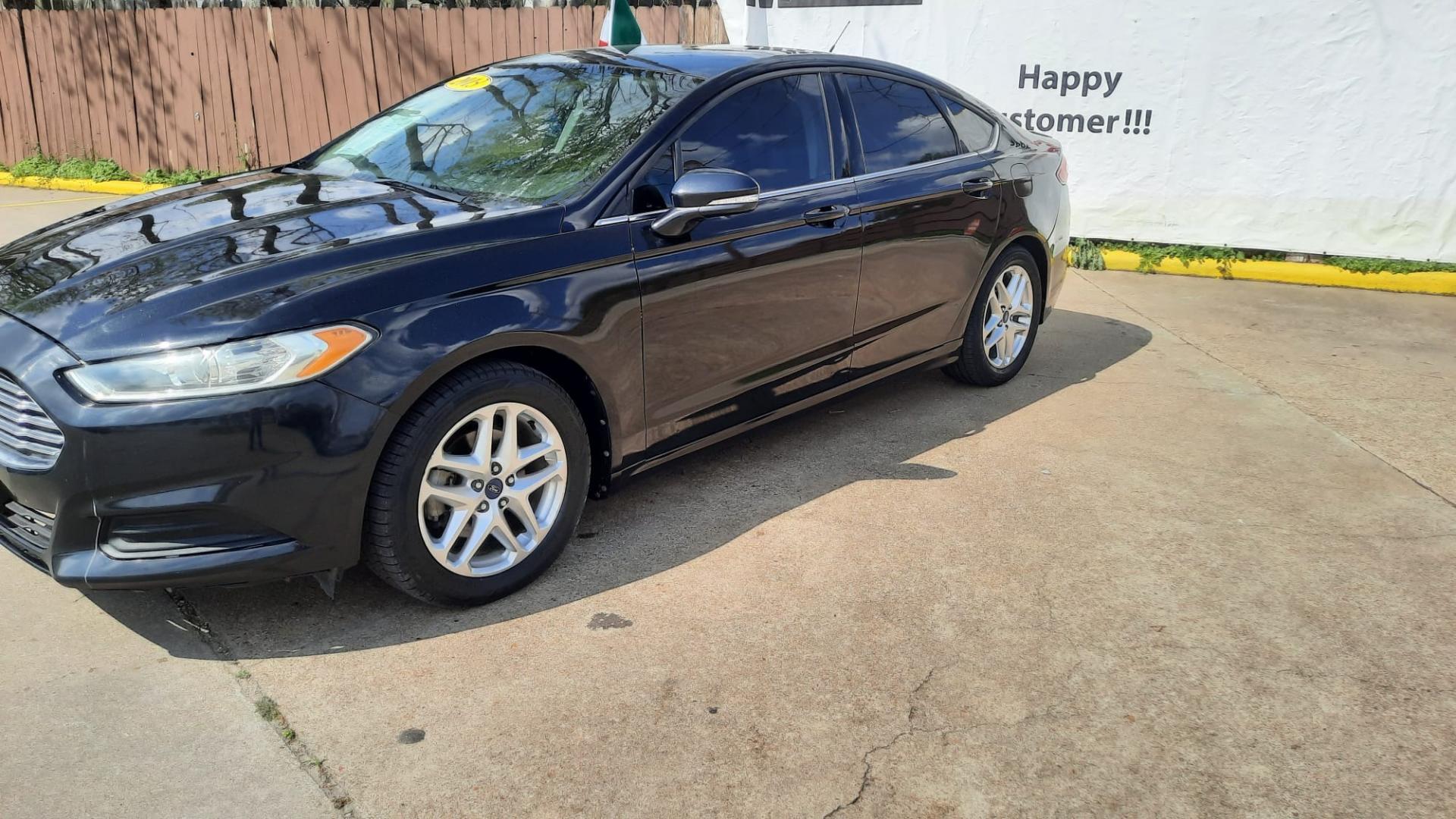 2013 Black Ford Fusion SE (3FA6P0HR7DR) with an 1.6L L4 DOHC 16V engine, located at 16710 Clay Rd., Houston, TX, 77084, (281) 859-7900, 29.834864, -95.656166 - LOW DOWN. LOW PAYMENTS. - Photo#2