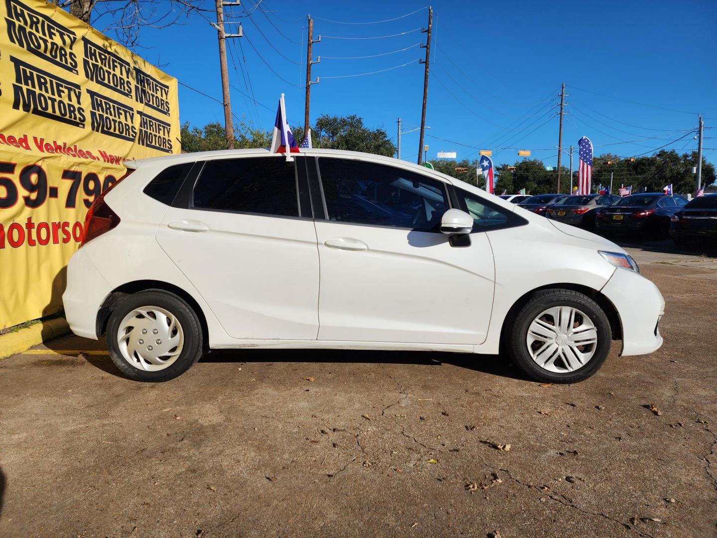 2019 White /Gray Honda Fit LX CVT (3HGGK5H47KM) with an 1.5L L4 SOHC 16V engine, CVT transmission, located at 16710 Clay Rd., Houston, TX, 77084, (281) 859-7900, 29.834864, -95.656166 - Photo#3