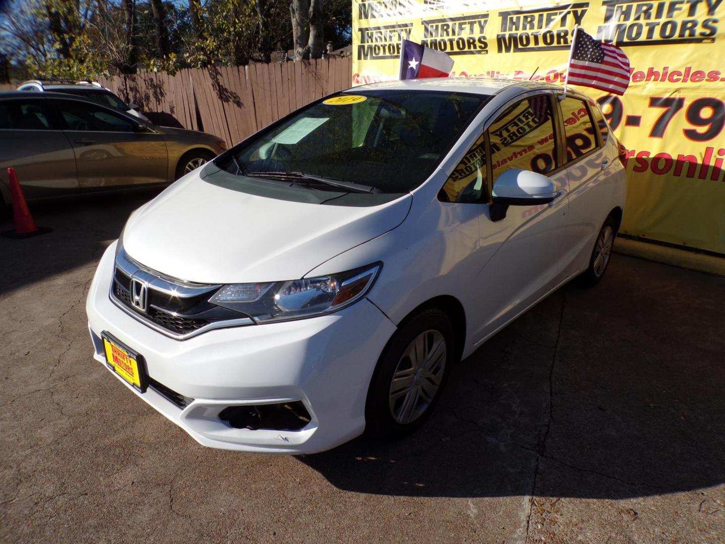 2019 White /Gray Honda Fit LX CVT (3HGGK5H47KM) with an 1.5L L4 SOHC 16V engine, CVT transmission, located at 16710 Clay Rd., Houston, TX, 77084, (281) 859-7900, 29.834864, -95.656166 - Photo#1