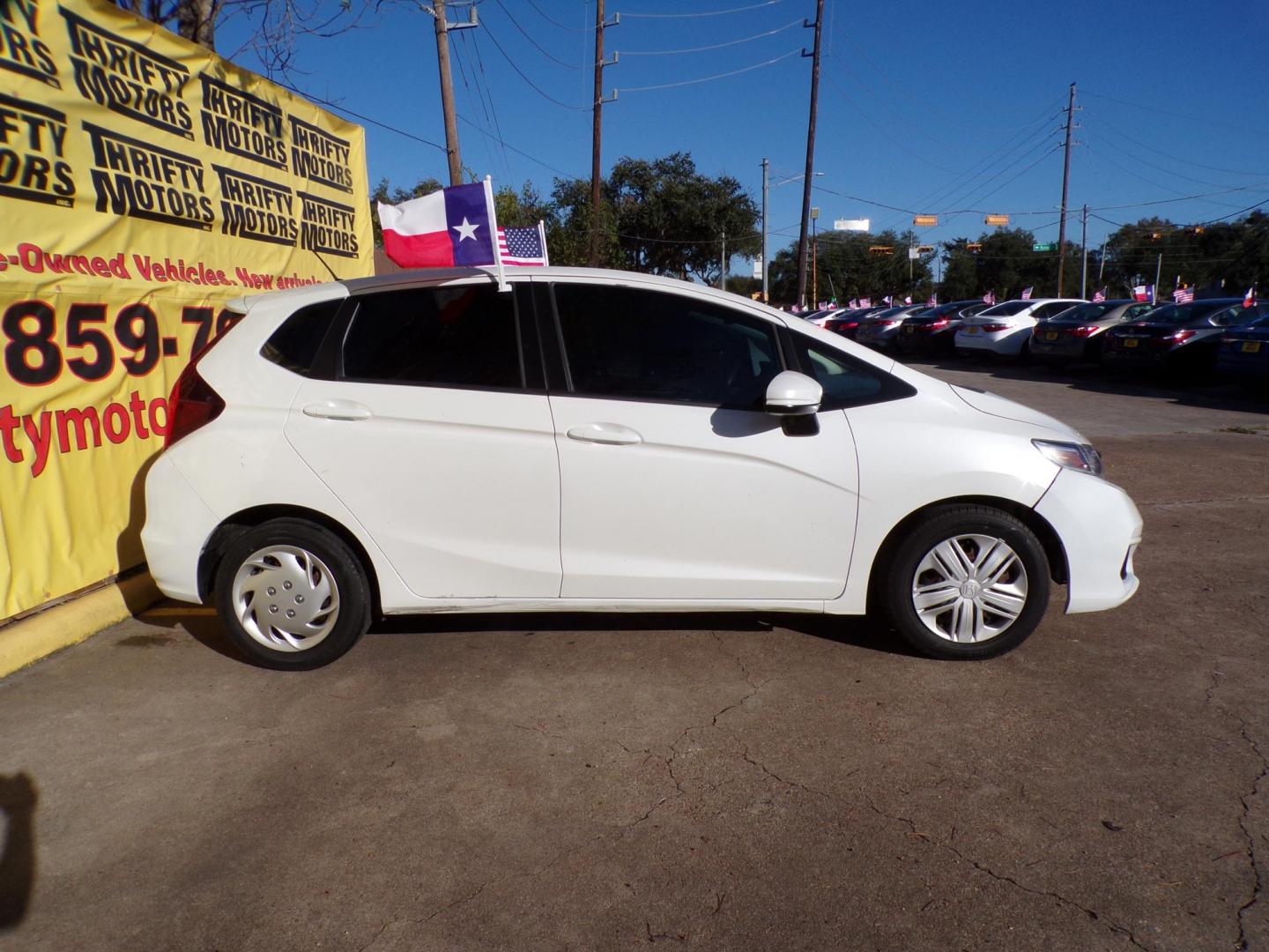 2019 White /Gray Honda Fit LX CVT (3HGGK5H47KM) with an 1.5L L4 SOHC 16V engine, CVT transmission, located at 16710 Clay Rd., Houston, TX, 77084, (281) 859-7900, 29.834864, -95.656166 - Photo#3