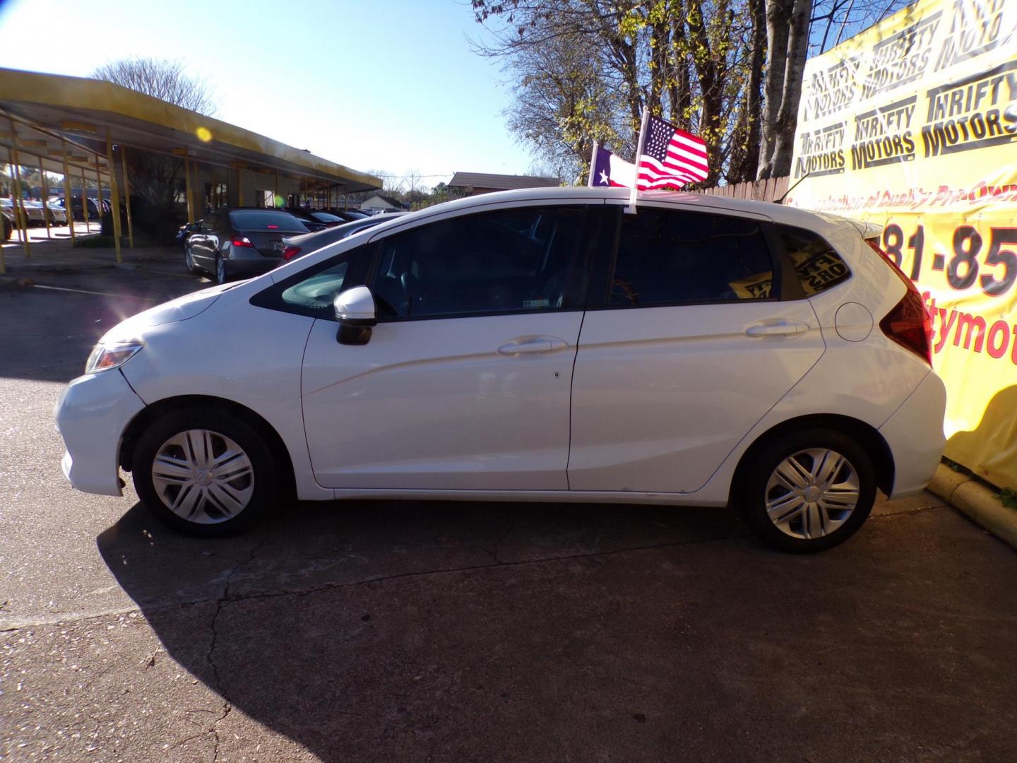 2019 White /Gray Honda Fit LX CVT (3HGGK5H47KM) with an 1.5L L4 SOHC 16V engine, CVT transmission, located at 16710 Clay Rd., Houston, TX, 77084, (281) 859-7900, 29.834864, -95.656166 - Photo#4